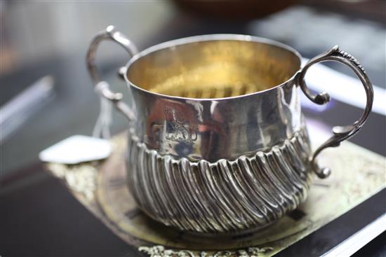 A George III demi-wrythened repousse silver porringer, 8 oz.